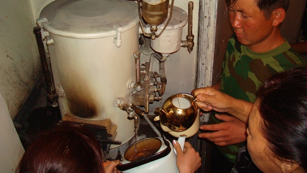 Getting hot water for the tea in the train