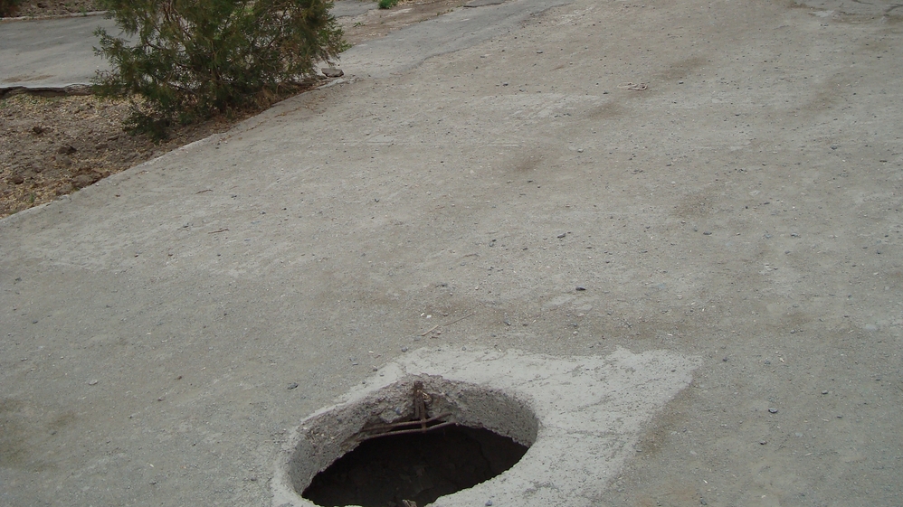 Holes on the sidewalk