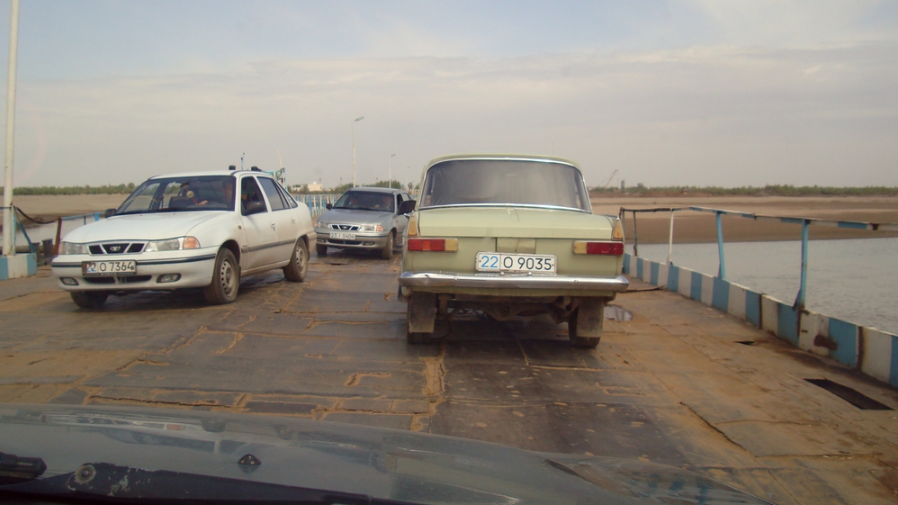 Crossing a makeshift bridge to the train station